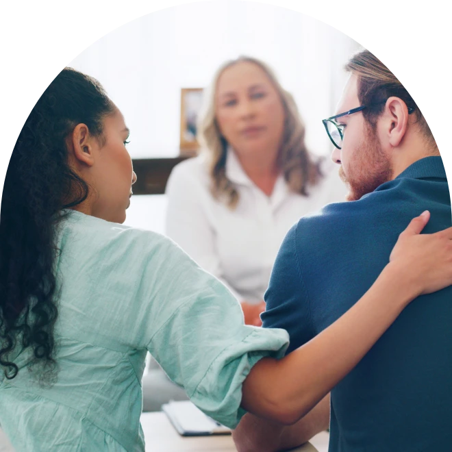 Woman and man speaking to therapist